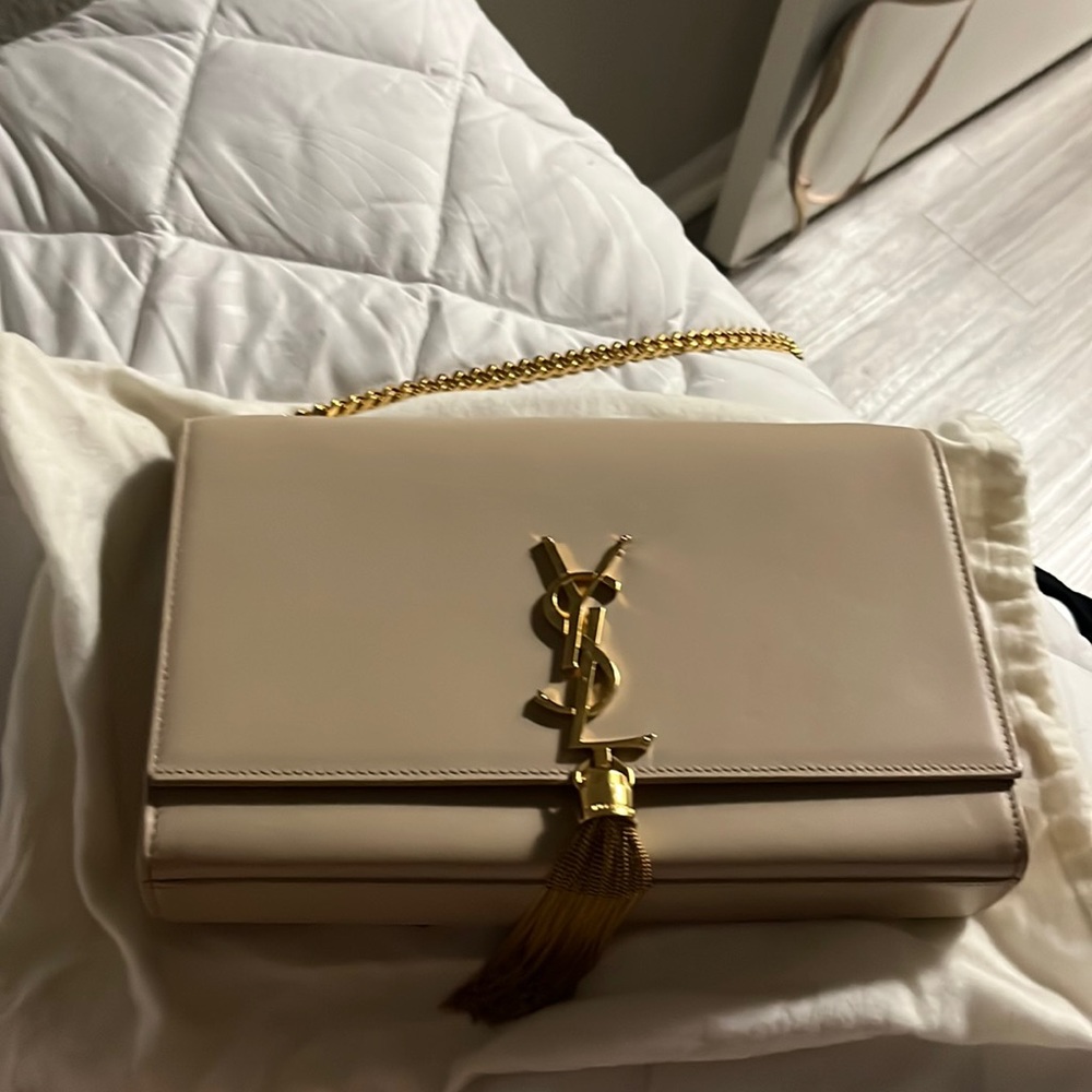 Saint Laurent small chain bag with gold tassel and gold chain